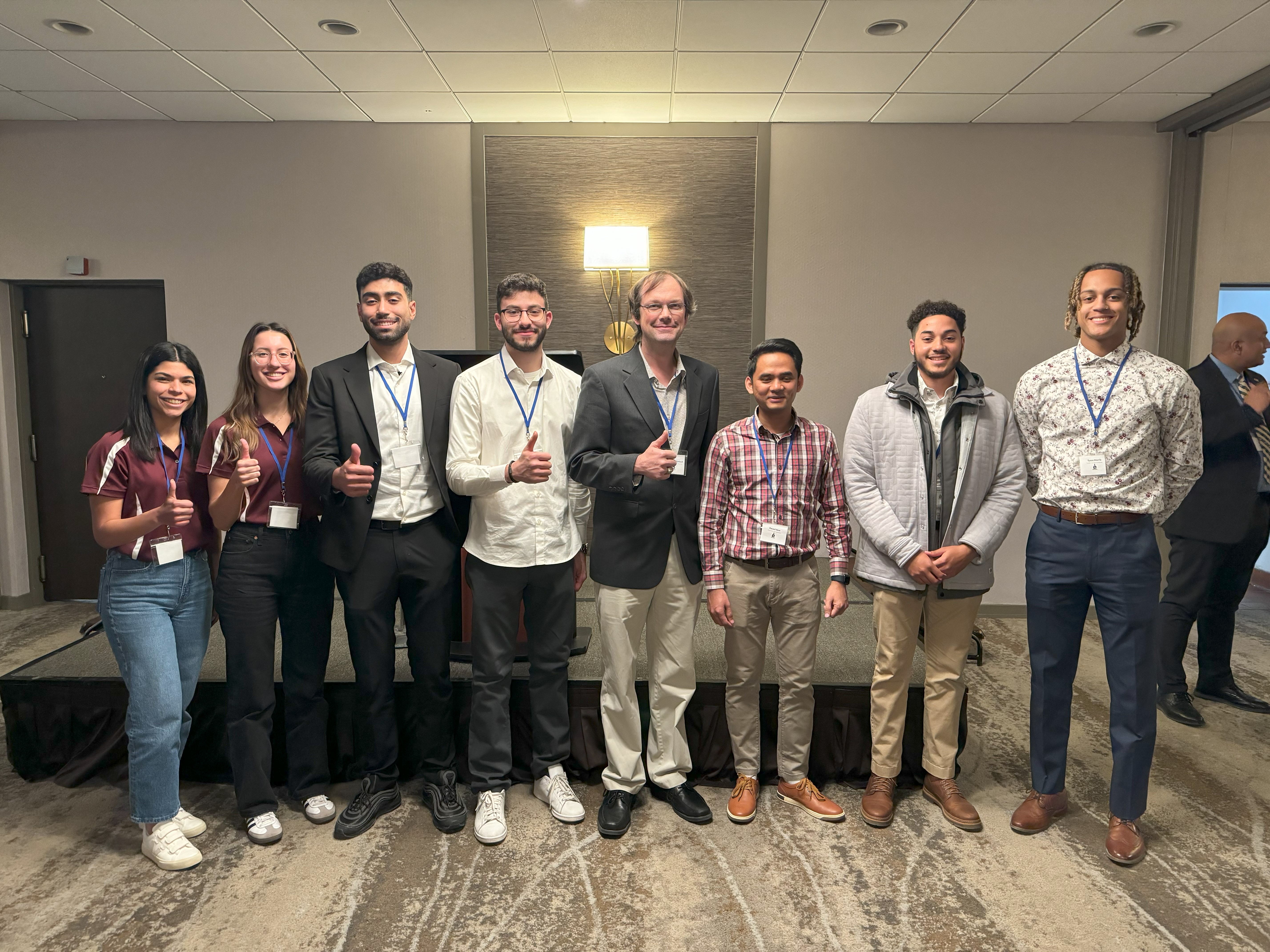 Sigma Delta officers posing with PTS officers from TAMU Qatar and Prairie View A&M, along with our advisor Dr. McFarland